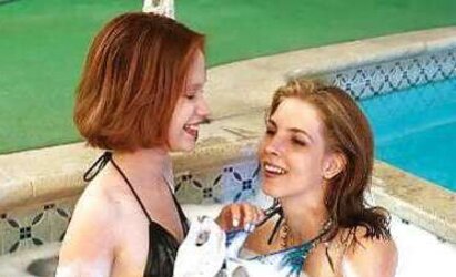 2 teenie dolls in a soapy pool