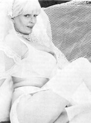 Vintage adult movie star Candy Samples in bridal garment
