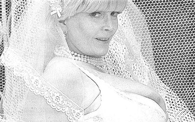 Vintage adult movie star Candy Samples in bridal garment