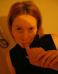 Grosse rousse aux gros seins