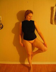 Grosse rousse aux gros seins