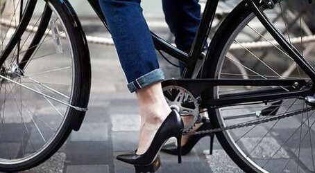 Honeys railing bicyles in high high-heeled slippers