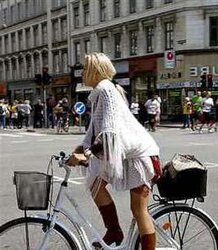 Honeys railing bicyles in high high-heeled slippers