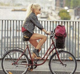 Honeys railing bicyles in high high-heeled slippers