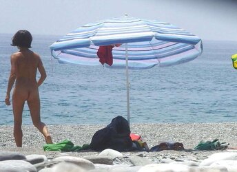 Beach disrobing, disrobing or getting bare