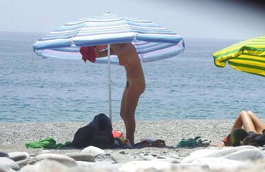 Beach disrobing, disrobing or getting bare