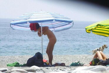 Beach disrobing, disrobing or getting bare