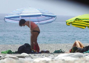 Beach disrobing, disrobing or getting bare