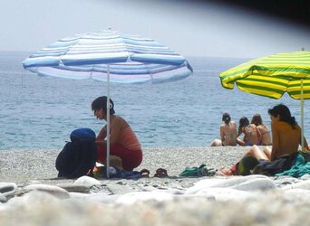 Beach disrobing, disrobing or getting bare