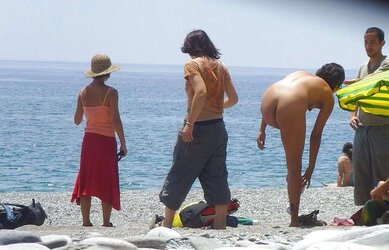 Beach disrobing, disrobing or getting bare