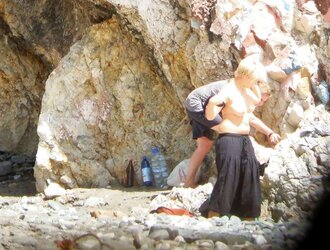 Beach disrobing, disrobing or getting bare