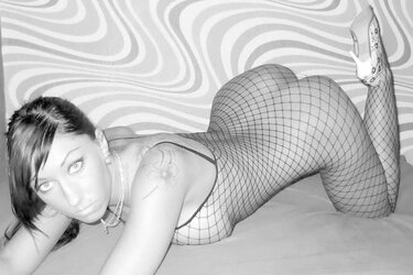 Super-Hot Stunner in Fishnet Figure Suit