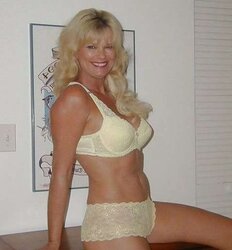Molten mature poses in yellow