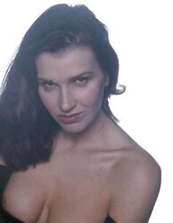 Sweet dark-haired posing in a studio