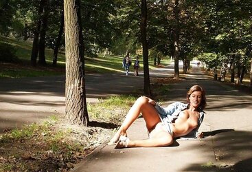 Suntanned female bare outdoors
