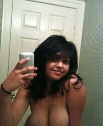 Big-Chested Stunner takes some selfshots