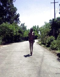 Dark-Hued sweetheart posing bare outside and in public
