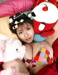 Pretty Asian in striped socks and hair bows