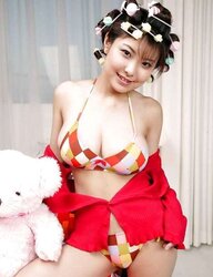 Pretty Asian in striped socks and hair bows