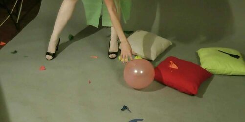 Redhead lean Lisa popping balloons