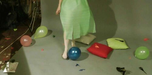 Redhead lean Lisa popping balloons
