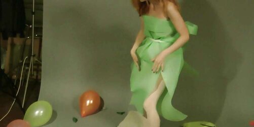 Redhead lean Lisa popping balloons