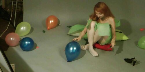Redhead lean Lisa popping balloons