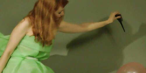 Redhead lean Lisa popping balloons