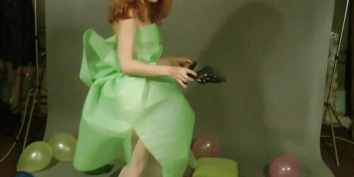 Redhead lean Lisa popping balloons