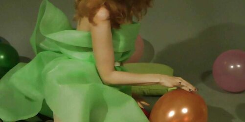 Redhead lean Lisa popping balloons