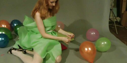 Redhead lean Lisa popping balloons