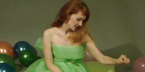 Redhead lean Lisa popping balloons