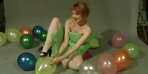 Redhead lean Lisa popping balloons