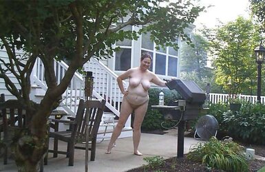 Mature naturist duo nude outside in public