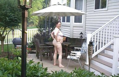 Mature naturist duo nude outside in public