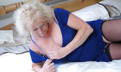 Old fledgling grandma plays with pinkish fake penis