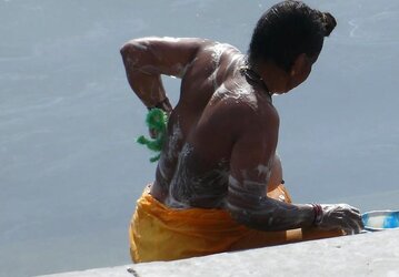 Indian Women bathing at sea ganga