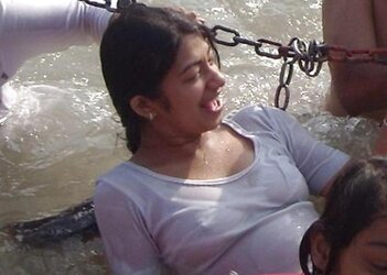 Indian Women bathing at sea ganga