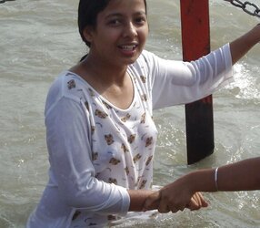 Indian Women bathing at sea ganga