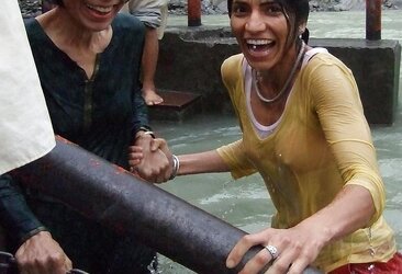 Indian Women bathing at sea ganga