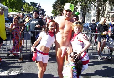 Chicks posing next to a jizz-shotgun