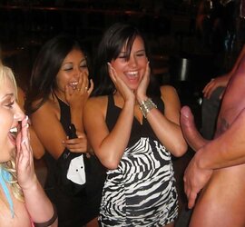 Chicks posing next to a jizz-shotgun