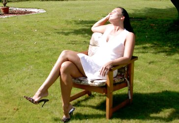 Mature dark-haired in leopard mules outside