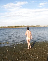 Lili bare on a public beach