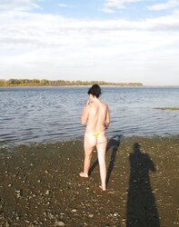 Lili bare on a public beach