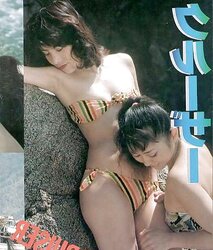 2 asian women getting frolic with each other