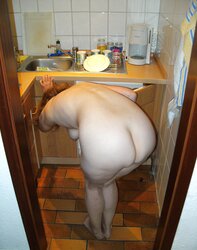 Wife with large mature backside in kitchen