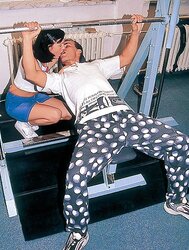 Black-Haired Eva poking the gym instructor