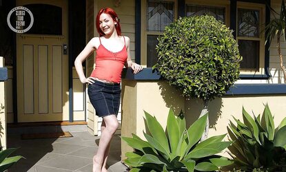 Luxurious redhead opens up her furry vulva outdoors