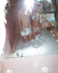 Duo having joy in the bathtub